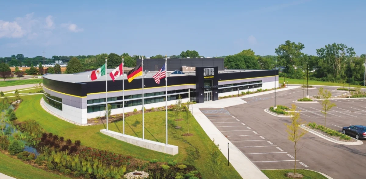 Aerial view of the ZOLLER Inc. headquarters in Ann Arbor with the flags of Mexico, Canada, Germany and the United States